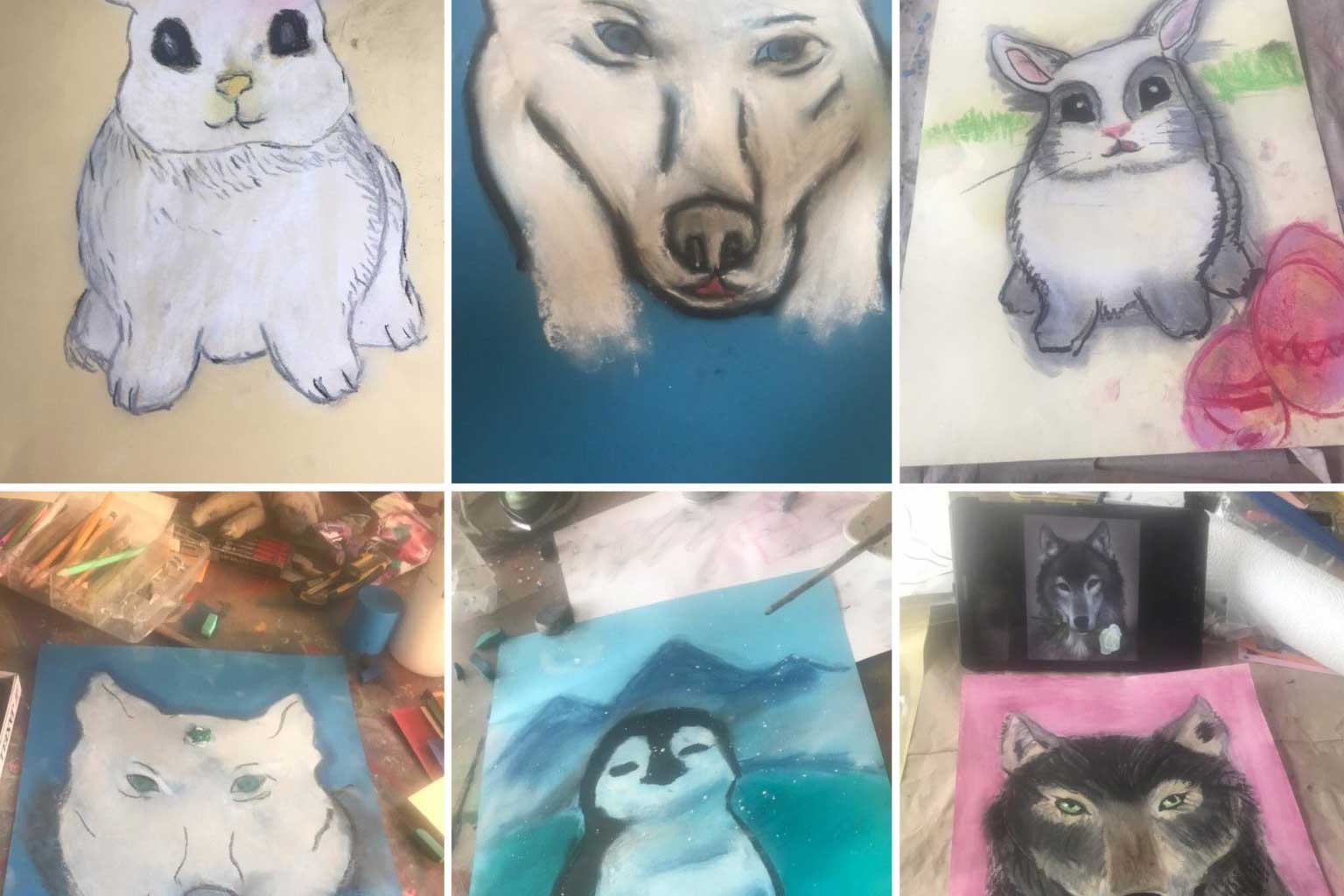 Mehrere selbst gemalte Bilder der Kinder: Hase, Hund, Wolf und Pinguin